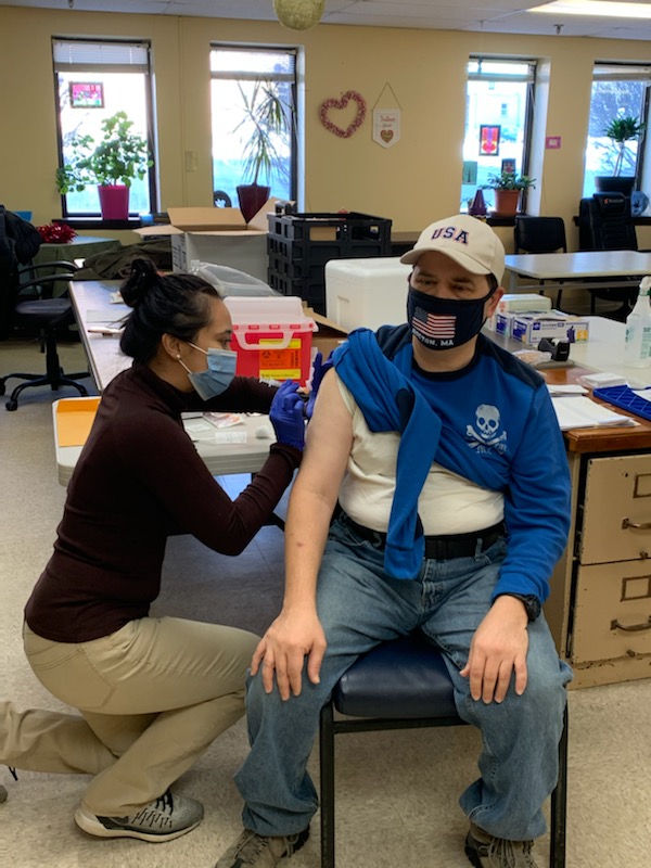 Man getting vaccine at clinic